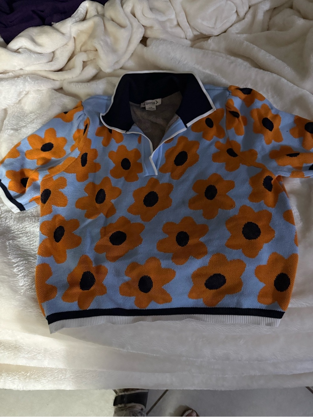 Nannette Light Blue Knit Polo Sweater with Orange Flower Motif